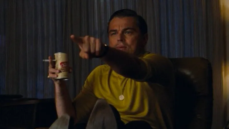 Leonardo DiCaprio as Rick Dalton in Once Upon a Time in Hollywood, excitedly pointing at the TV screen — the original source of the Leo Pointing meme